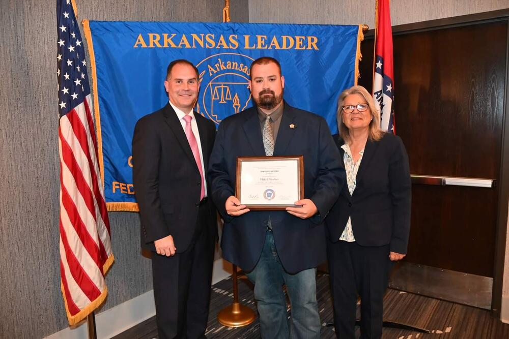**NOTE** Caption information for attached photo:  "Newton County Chief Deputy Mike Blocker receives his ARKANSAS LEADER graduation certificate from Colonel Mike Hagar (left), Secretary of the Arkansas Department of Public Safety and Director of the Arkansas State Police and Dr. Cherly May (right), Director of the University of Arkansas Criminal Justice Institute. (Photo Credit CJI)